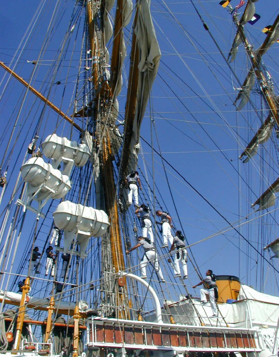 sailors on the ratlines making repairs